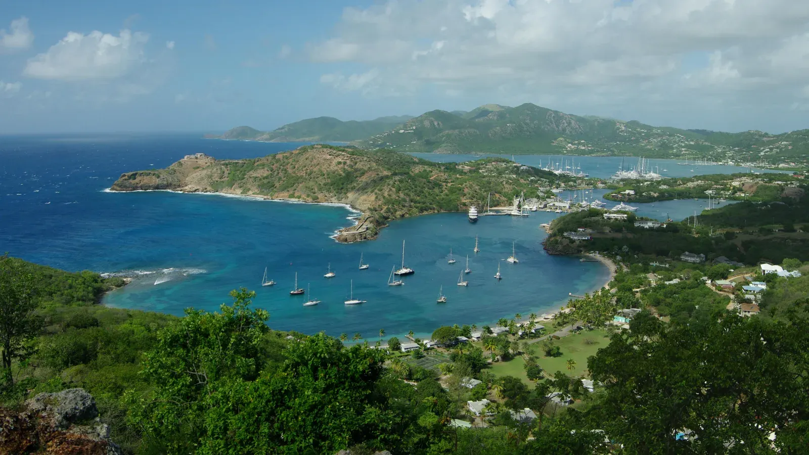 English Harbour and Falmouth Harbour on Antigua, seen from Shirley Heights, with yachts at anchor