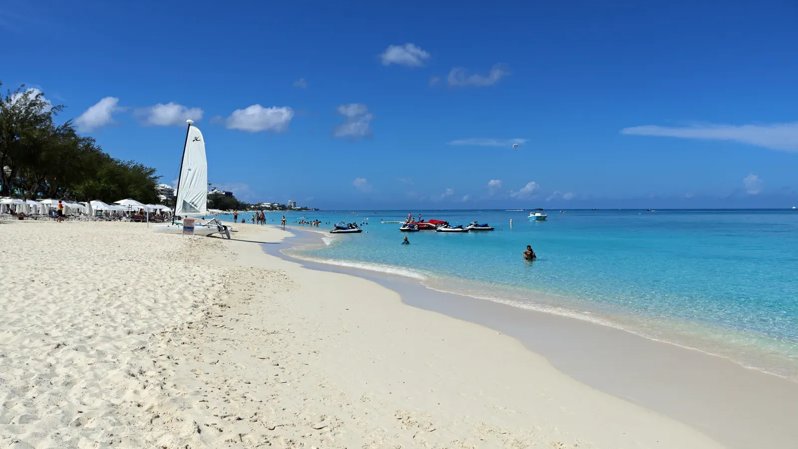Seven Mile Beach on Grand Cayman, white sand curving along clear turquoise water