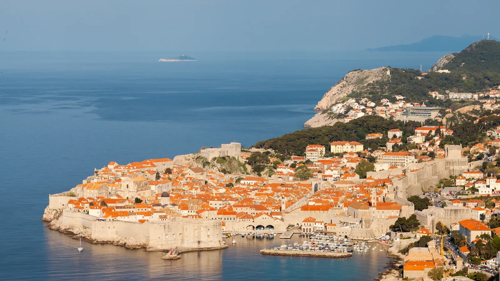 Dubrovnik's walled Old Town and its orange roofs on the Adriatic Sea in early morning light, Croatia