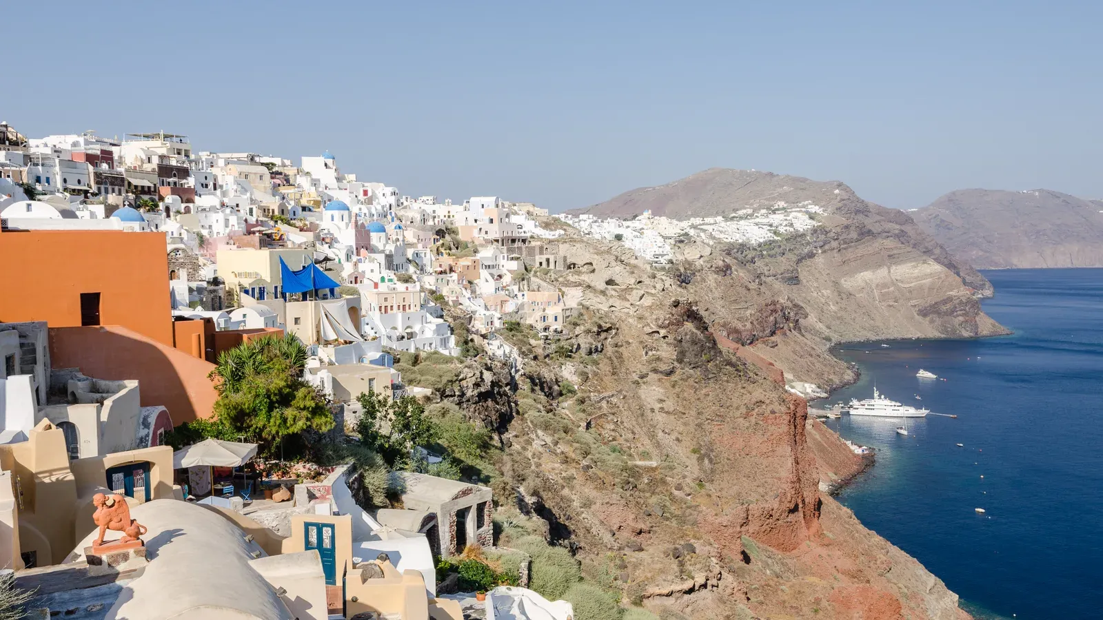 Whitewashed houses of Oia along the caldera cliffs above the Aegean Sea on Santorini, Greece
