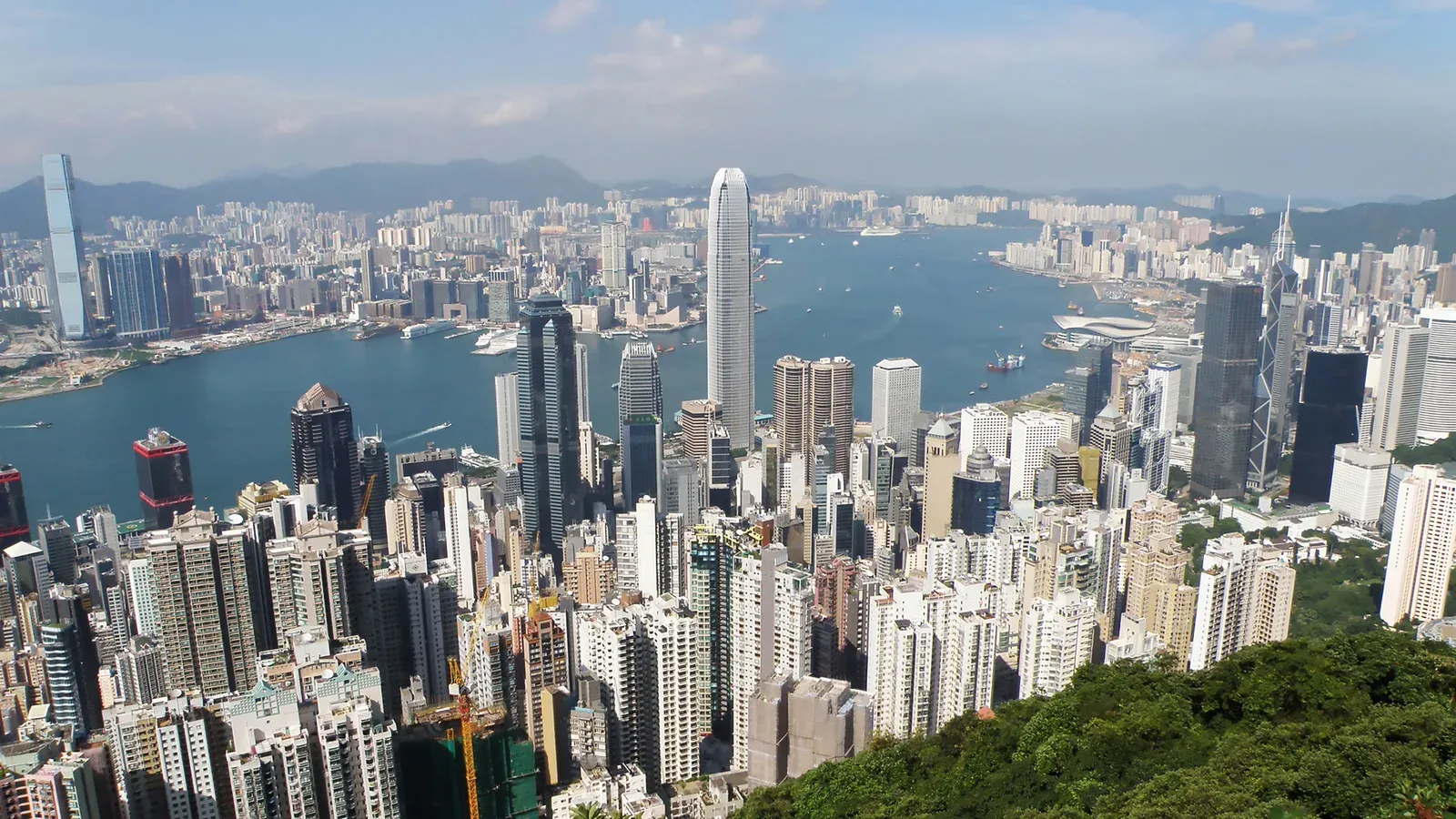 Hong Kong Island's skyscrapers and Victoria Harbour with Kowloon beyond, seen by day from Lugard Road on Victoria Peak